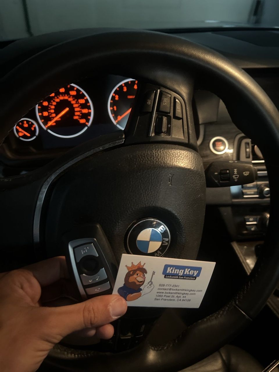 A BMW key being cut at the van